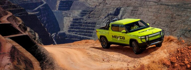 MEVCO electric truck driving on a rural road.